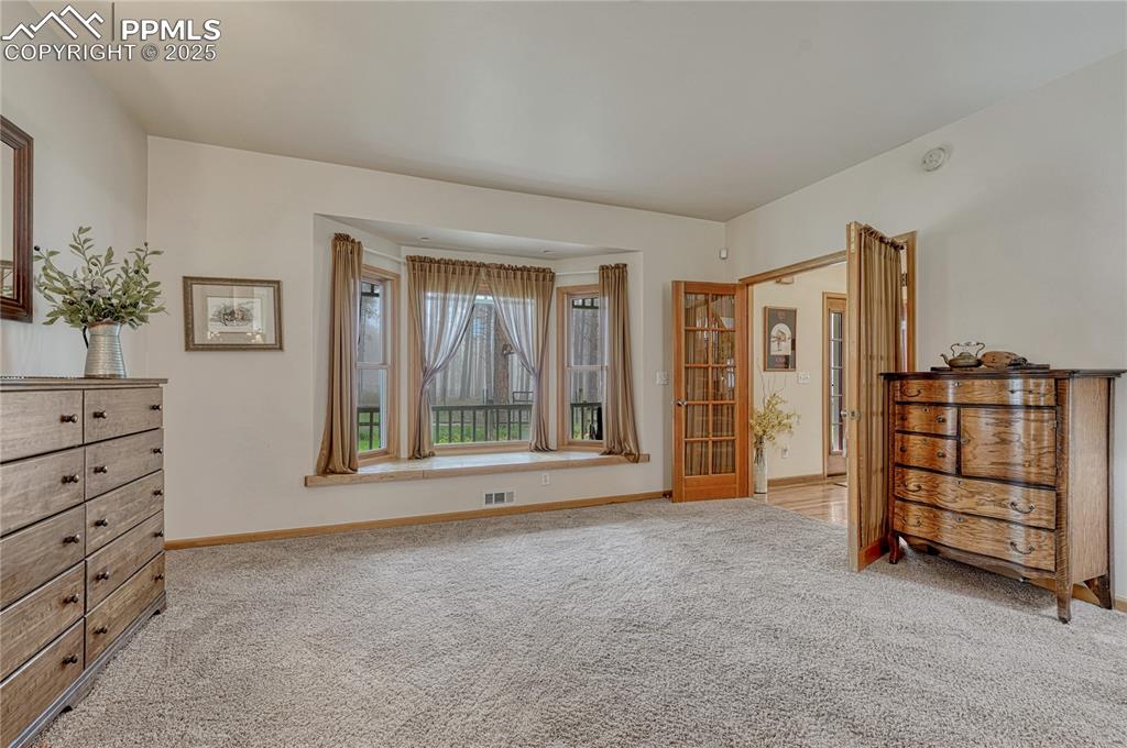 Image 26 of 50: Unfurnished bedroom featuring carpet and baseboards