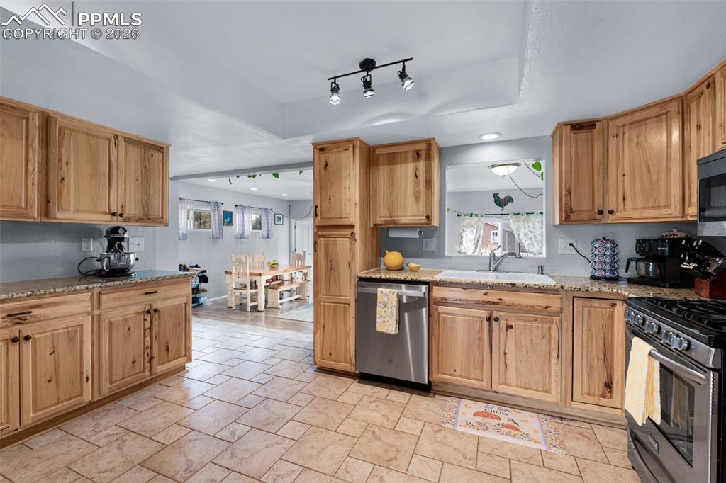 Image 17 of 50: Kitchen has lots of storage and lots of workspace