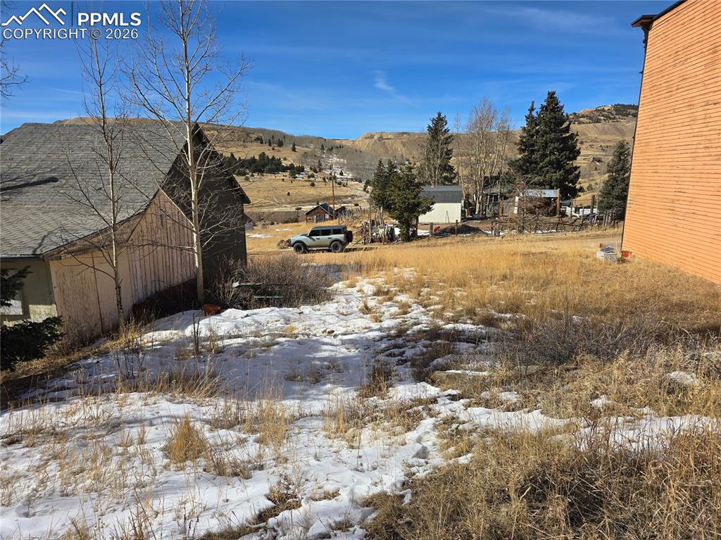 Image 13 of 16: Backside of home & Additional Lots
