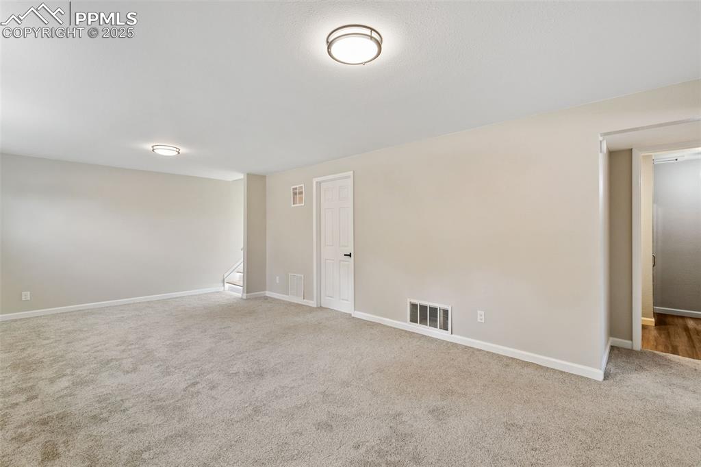 Image 18 of 50: New interior paint and new carpet in the basement. 