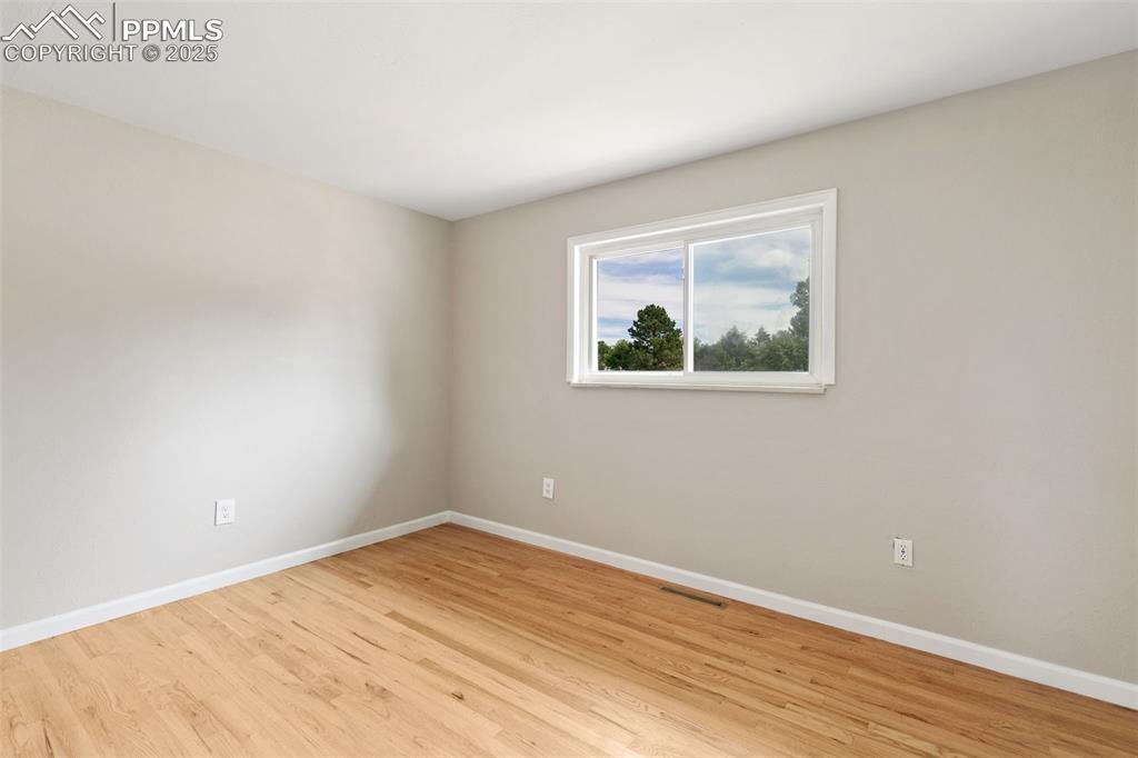 Image 31 of 50: New interior paint and refinished 2" oak flooring on main level.