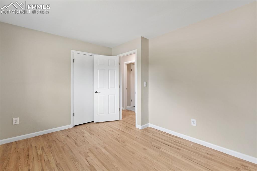 Image 36 of 50: New interior paint and refinished 2" oak flooring on main level.