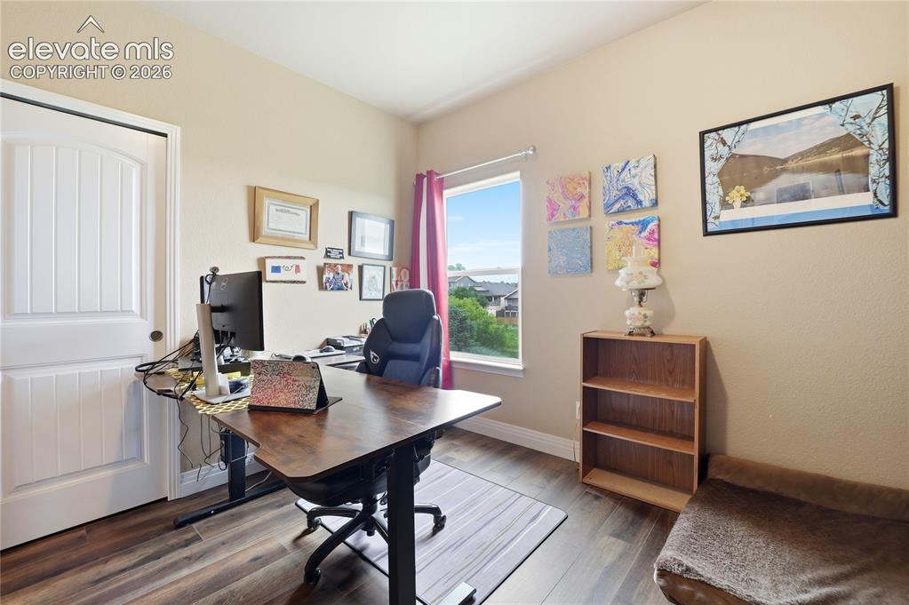 Image 15 of 46: Secondary main level bedroom used as an office