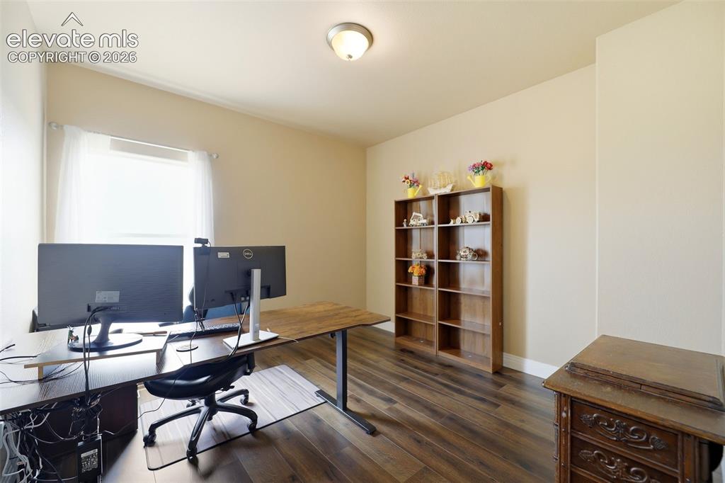 Image 15 of 36: Bedroom currently used as an office