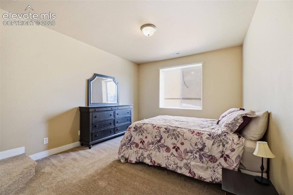 Image 22 of 36: Basement bedroom