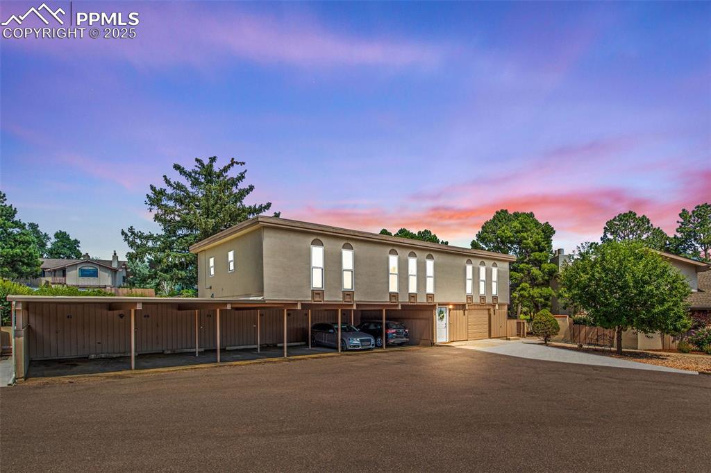 Caption: View of front facade with covered parking