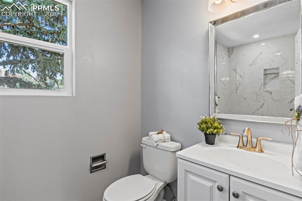 Image 17 of 44: Bathroom with vanity and a shower