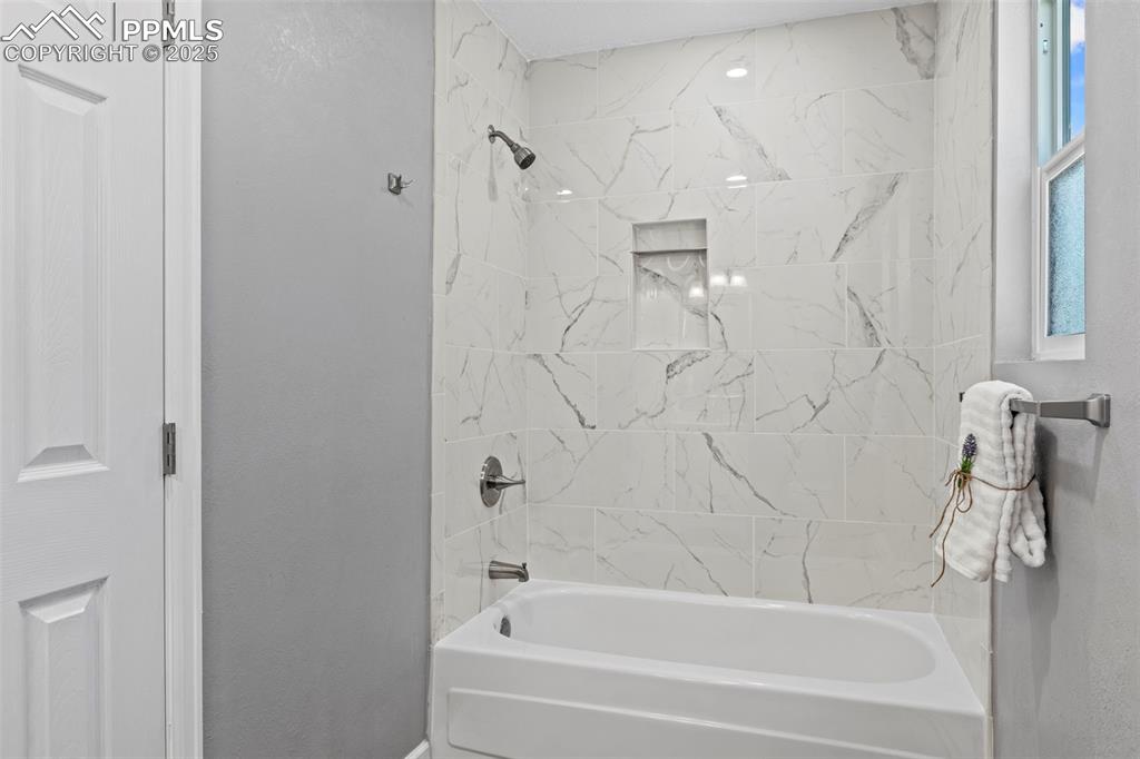 Image 18 of 44: Full bath featuring shower / tub combination