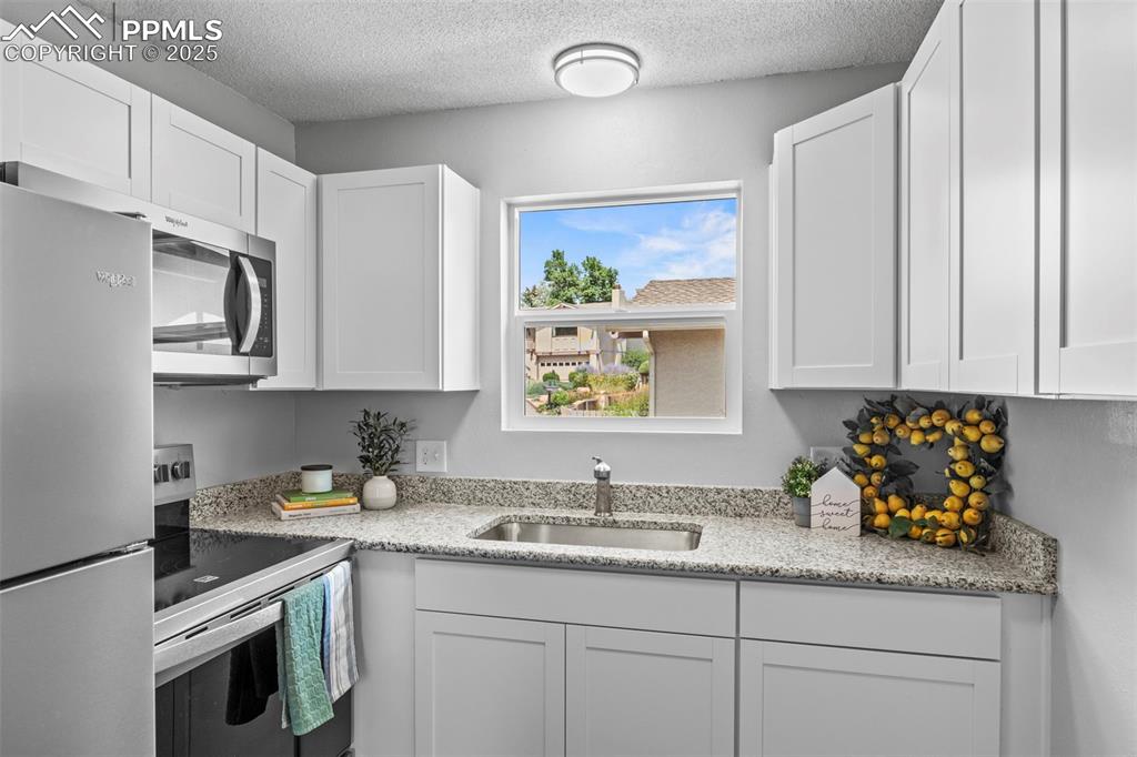 Image 26 of 44: Kitchen of F6 portion of the Condo