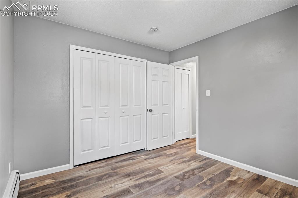 Image 29 of 44: Bedroom of F6 portion of the Condo facing door