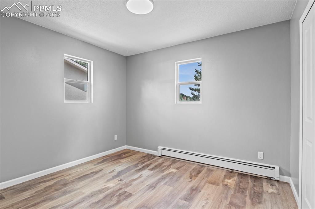 Image 30 of 44: Bedroom of F6 portion of the Condo facing Window
