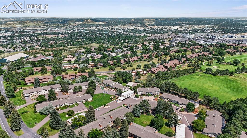 Image 41 of 44: View of property location featuring nearby suburban area and a golf club