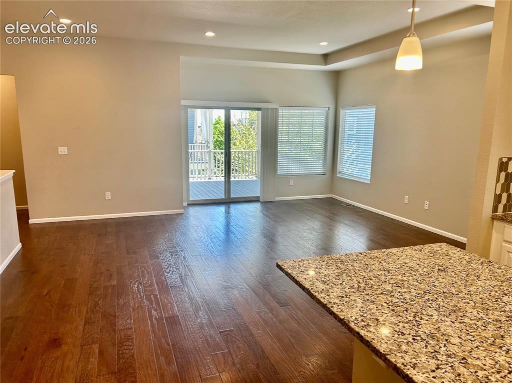 Image 11 of 38: Sliding door leads to deck 