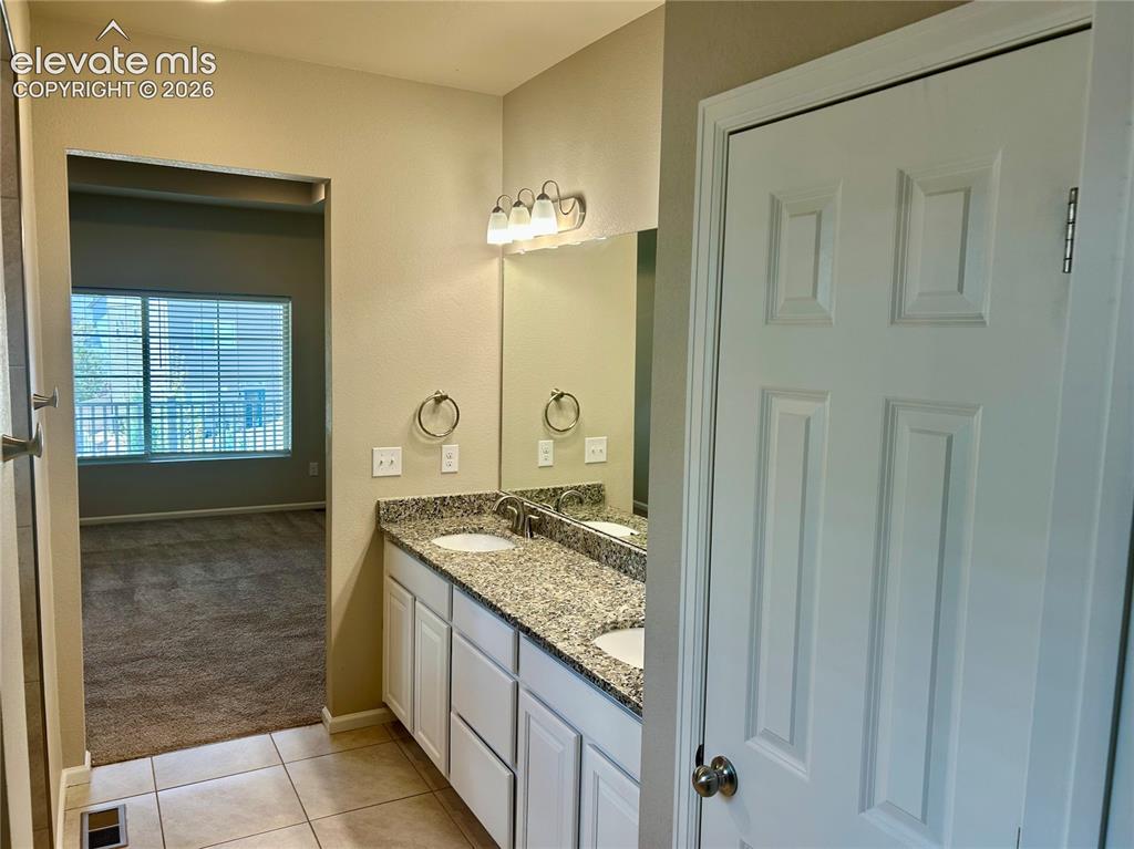 Image 19 of 38: view 2 of primary bathroom