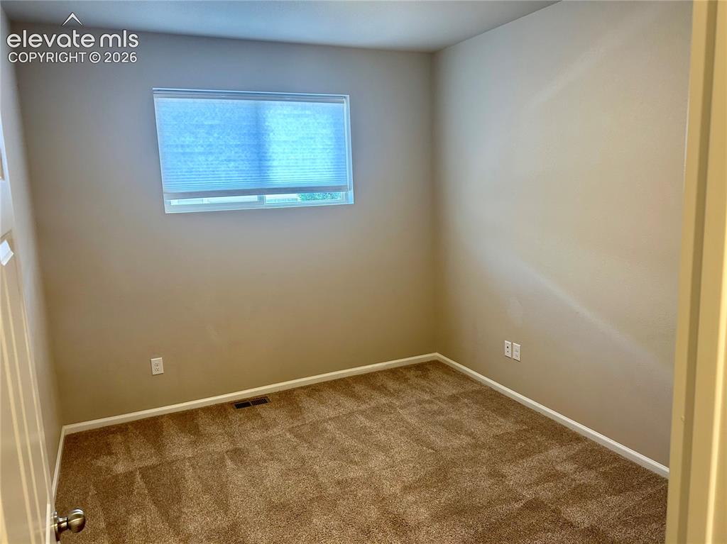 Image 22 of 38: Main level office/flex space down the hall from Primary bedroom
