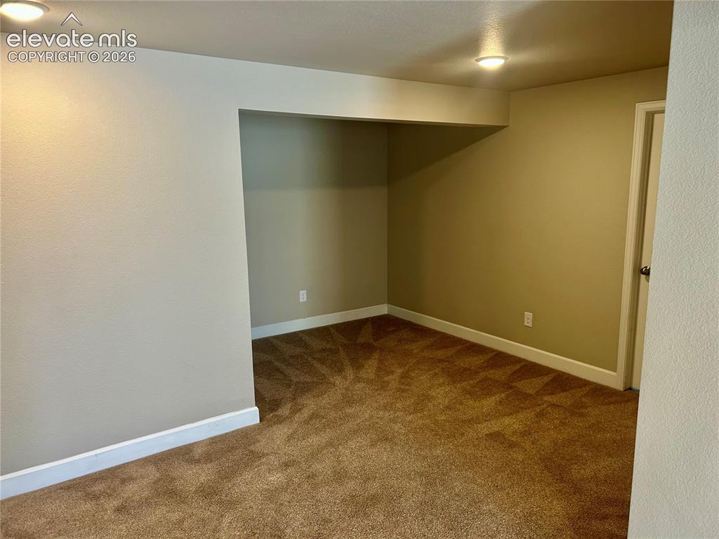 Image 28 of 38: Nook in basement living room. Great for a second office space.