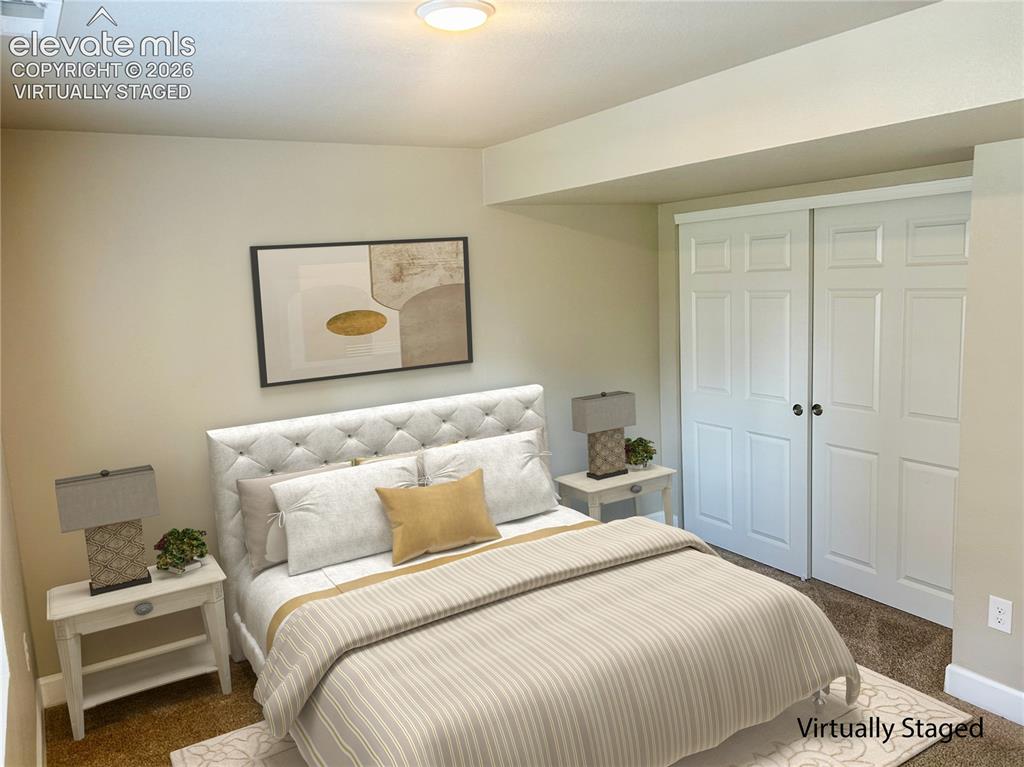 Image 29 of 38: Basement level bedroom virtually staged