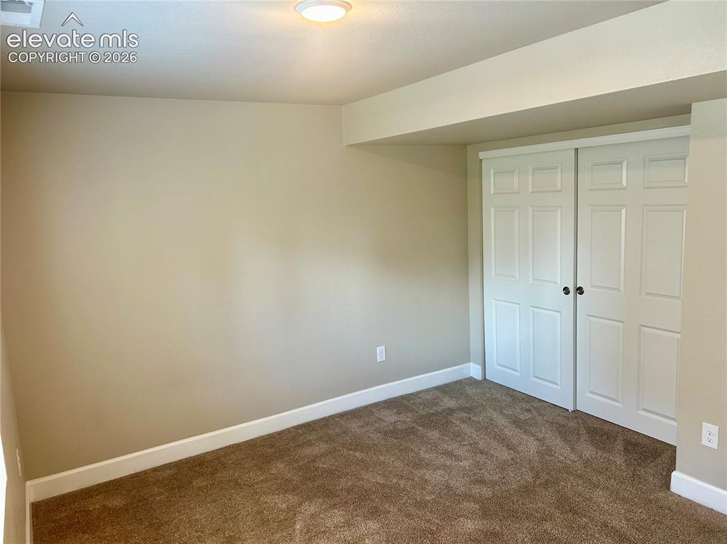 Image 30 of 38: Basement level bedroom 