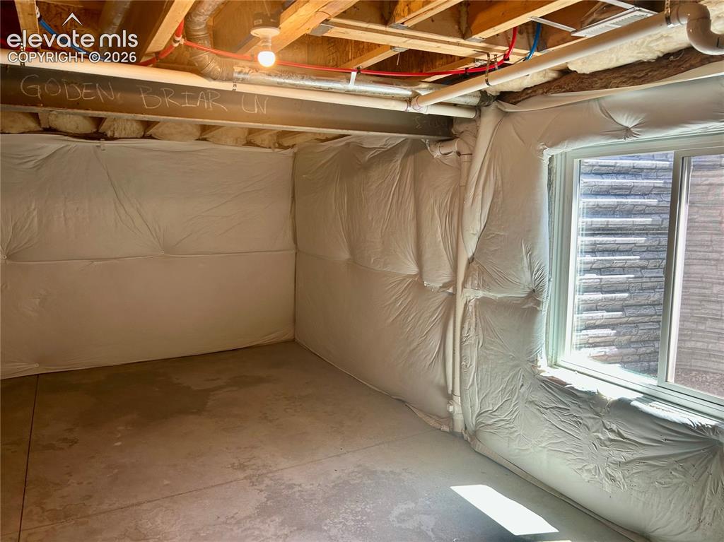 Image 35 of 38: Egress window in unfinished basement space