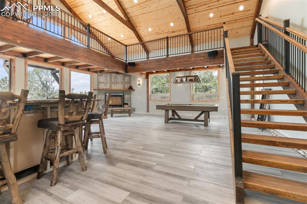 Image 30 of 47: Bonus Room with Gas Fireplace, Kitchen and Loft