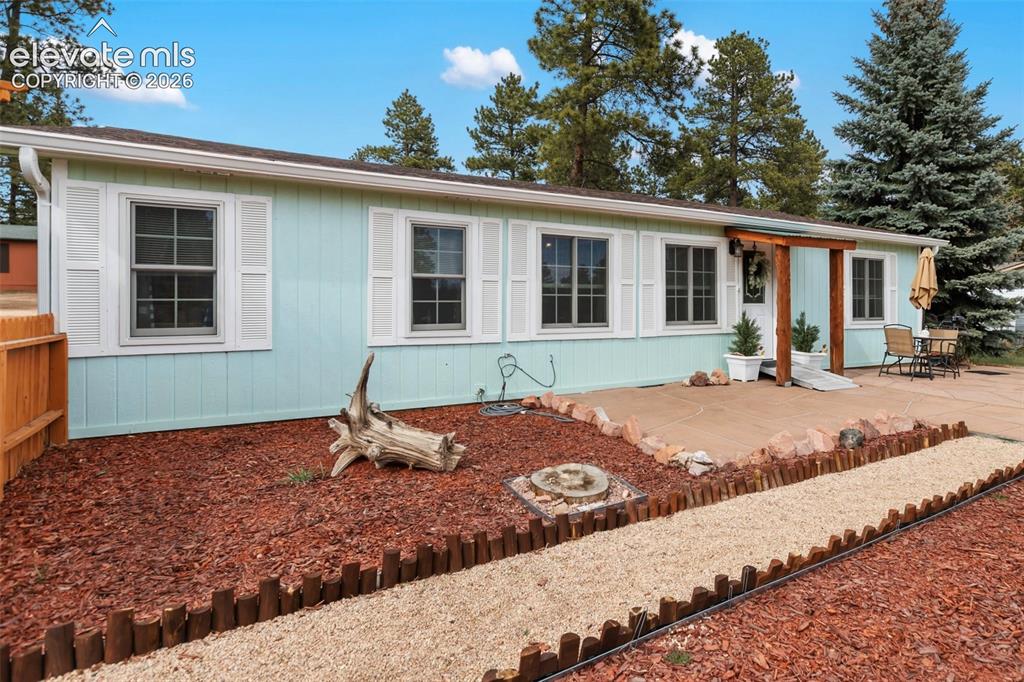 Image 1 of 27: Beautifully landscaped front yard with fantastic front patio