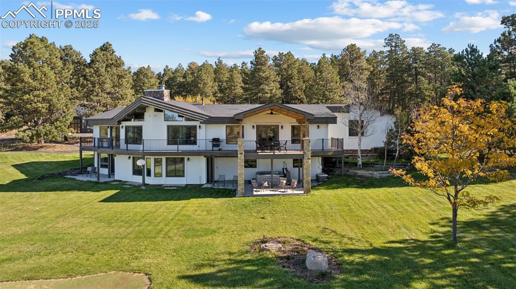 Image 41 of 49: Single story home featuring a mountain view, a front lawn, stucco siding, d