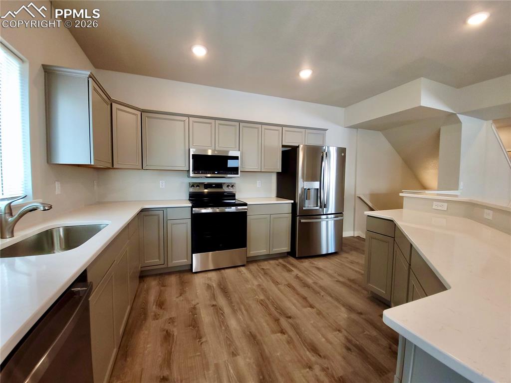 Image 10 of 47: Stainless steel range oven, microwave, and dishwasher included!
