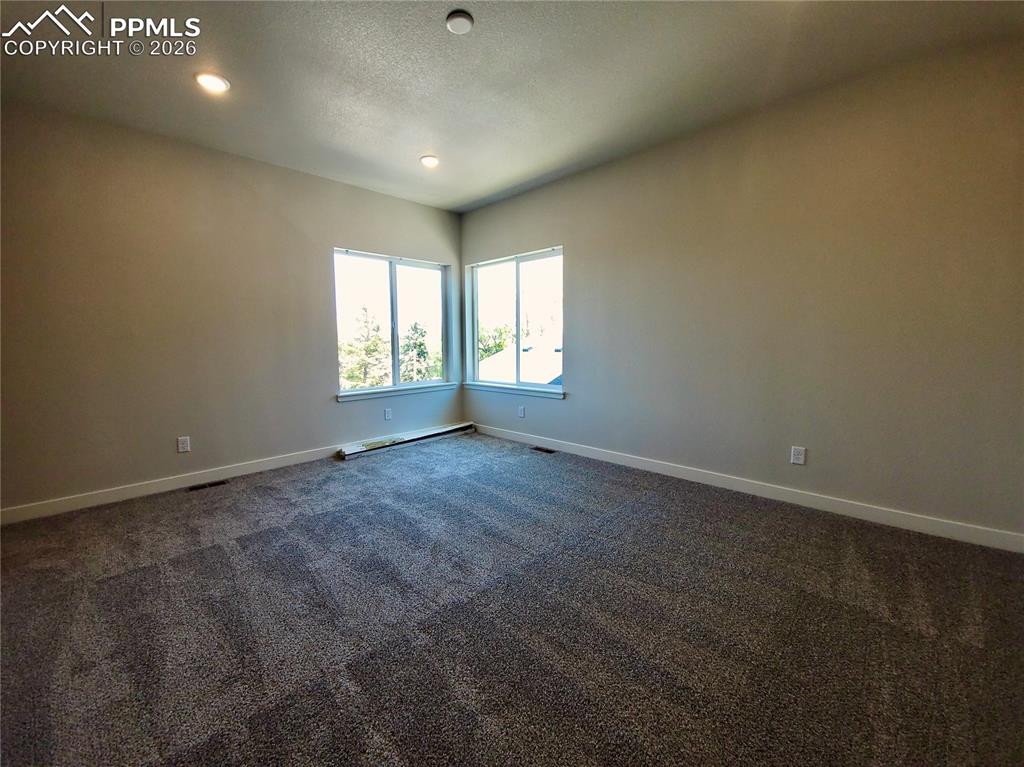 Image 14 of 47: Spacious primary bedroom with 9ft ceiling (example finishes)