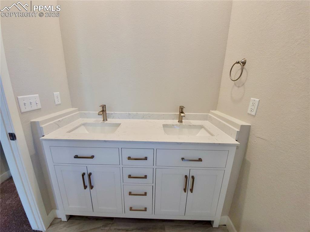 Image 19 of 47: Double vanity with quartz counters and undermount sinks (example finishes)