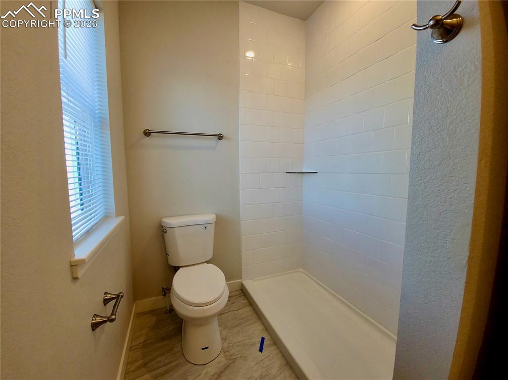 Image 20 of 47: Walk-in shower with tile surround (example finishes)