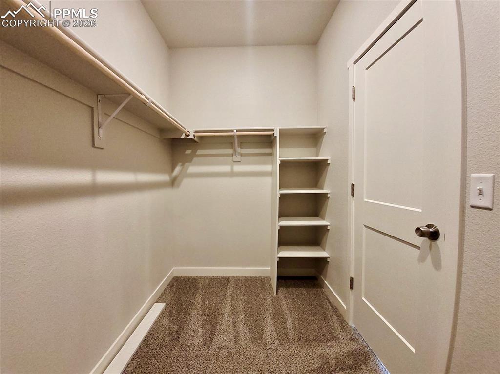 Image 29 of 47: Large walk-in closet