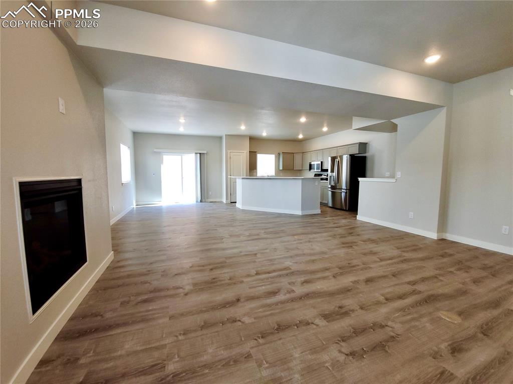 Image 3 of 47: Main level open floorplan with walk-out to the back yard and powder bath (e