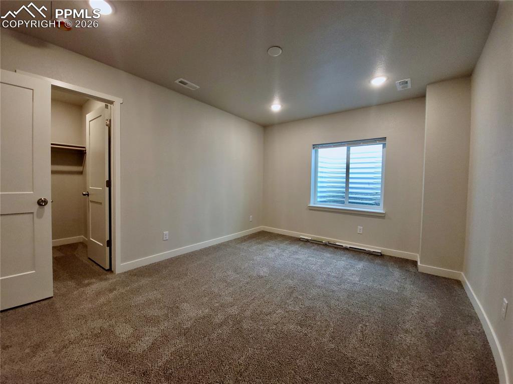 Image 35 of 47: Basement bedroom with walk-in closet (example finishes)