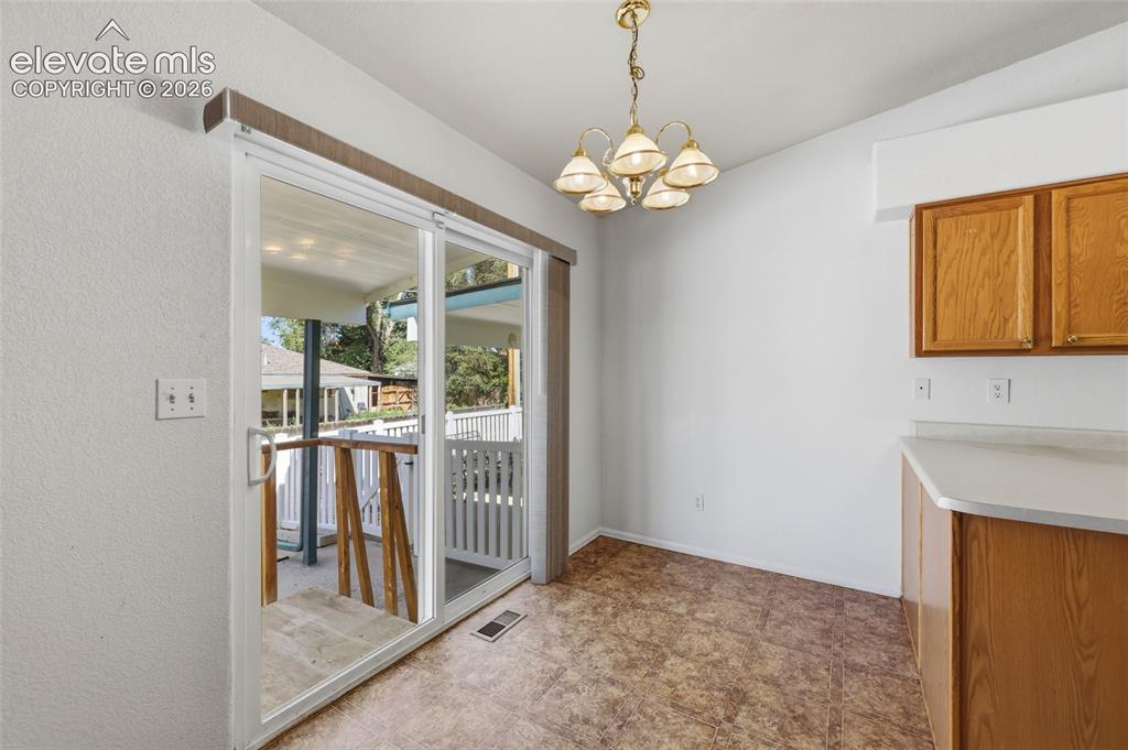 Image 15 of 45: eat in kitchen with walk out