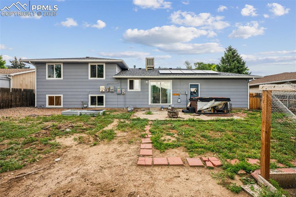Image 18 of 19: View of the rear of the home — fully fenced and ready for entertaining.