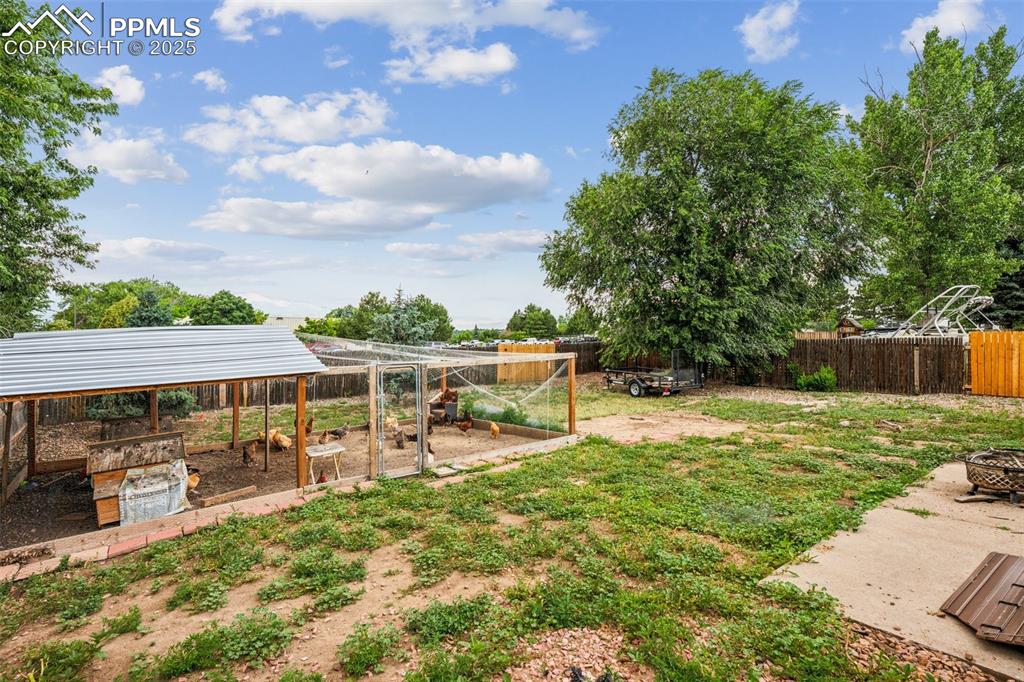 Image 19 of 19: Wider view of the backyard, perfect for gatherings or pets.