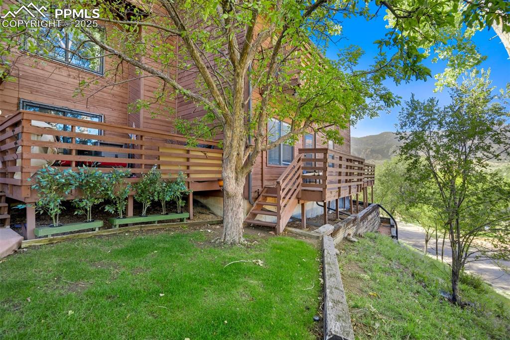Caption: View of building exterior with a mountain view and stairway