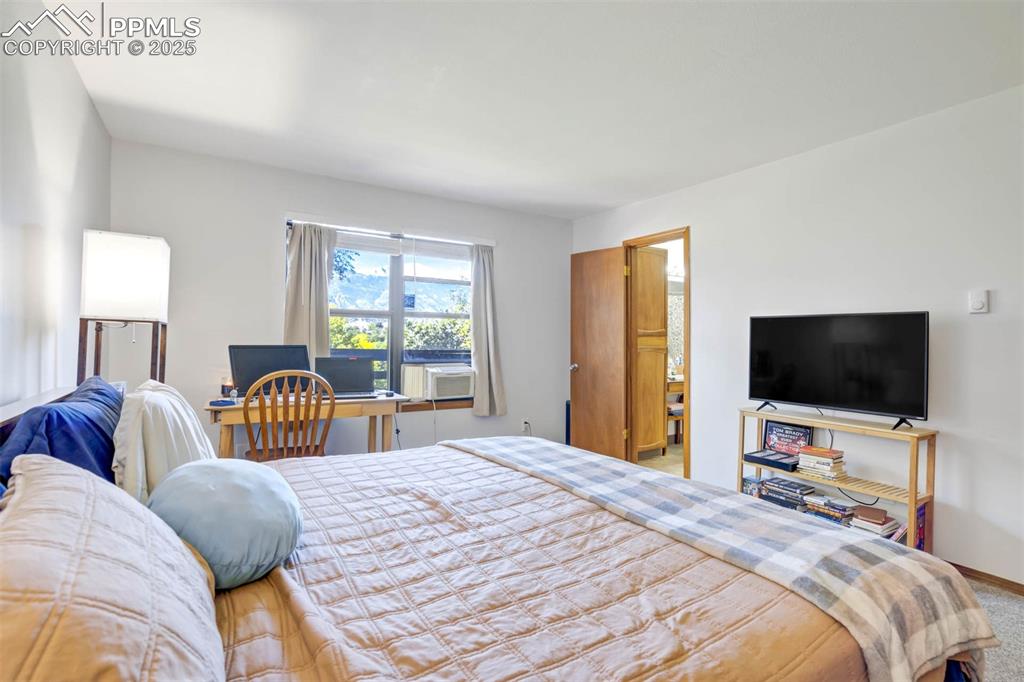 Image 19 of 35: Carpeted bedroom with baseboards