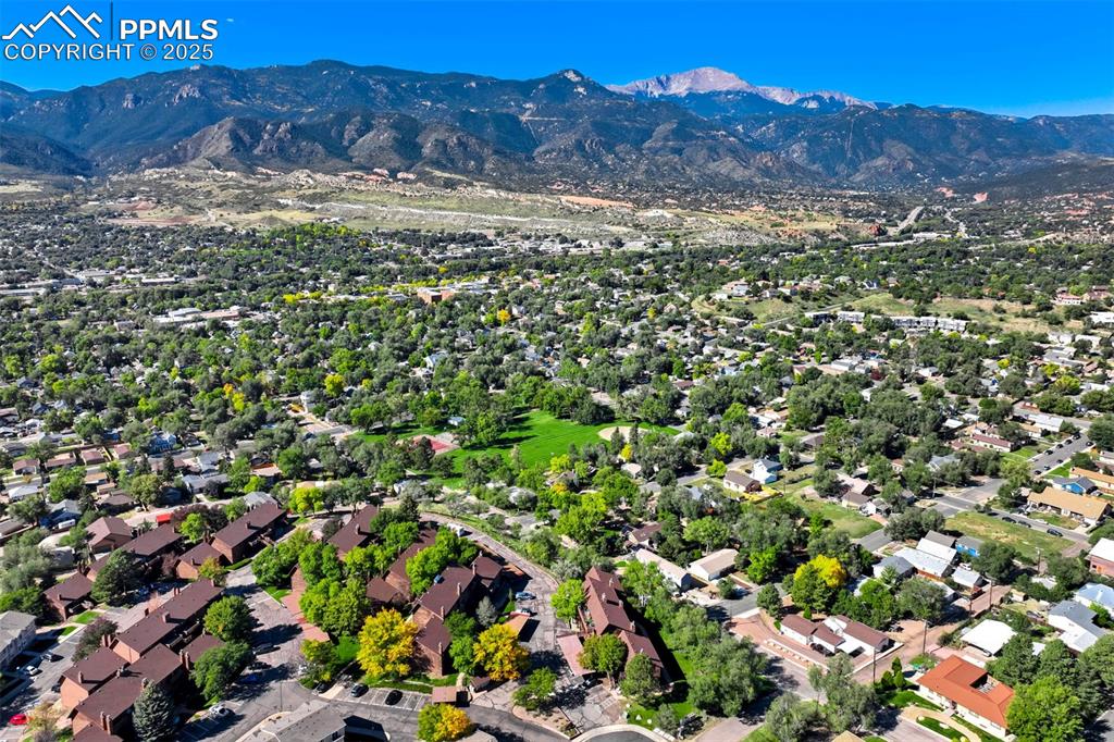 Image 33 of 35: View of property location featuring a mountain backdrop and nearby suburban