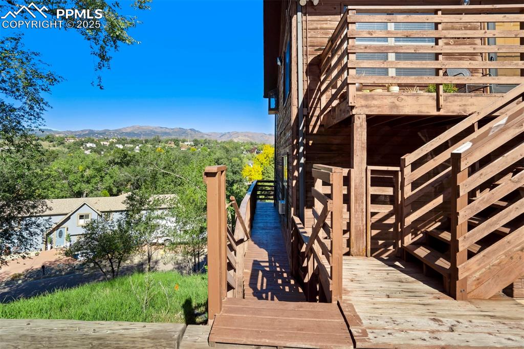 Image 6 of 35: Dock featuring a deck with mountain view and stairs