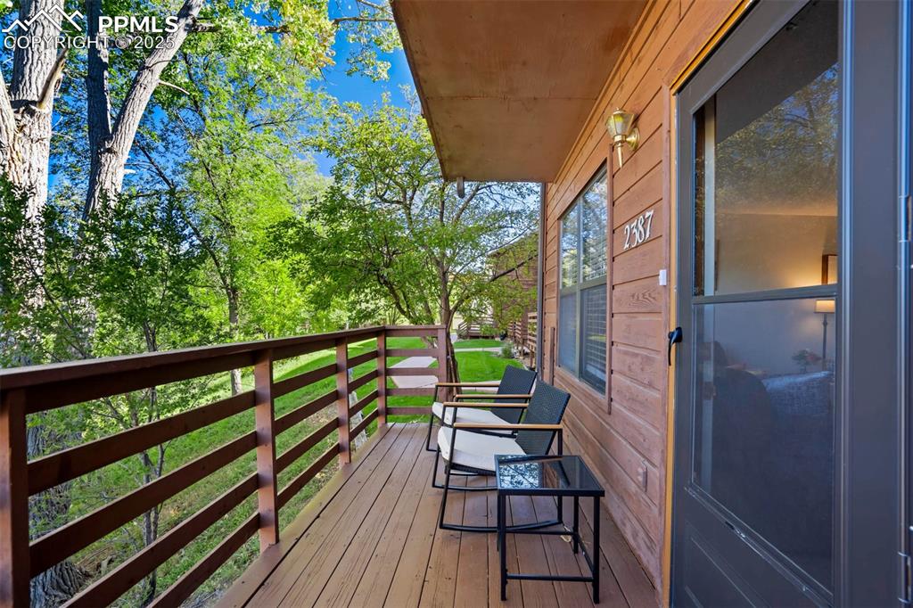 Image 8 of 35: Wooden deck by the front door