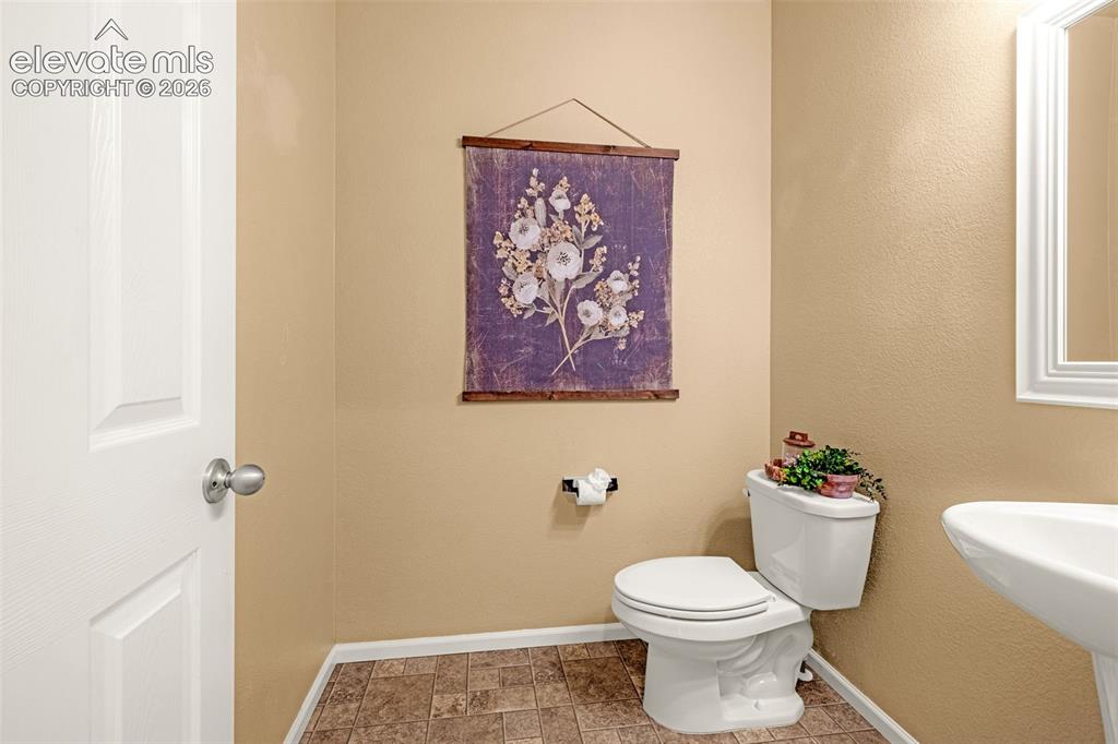 Image 18 of 44: Main level half bath