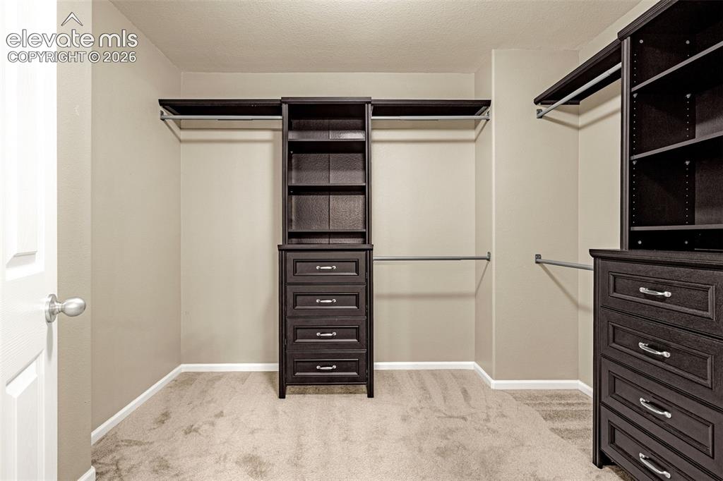 Image 27 of 44: Primary Walk-in Closet