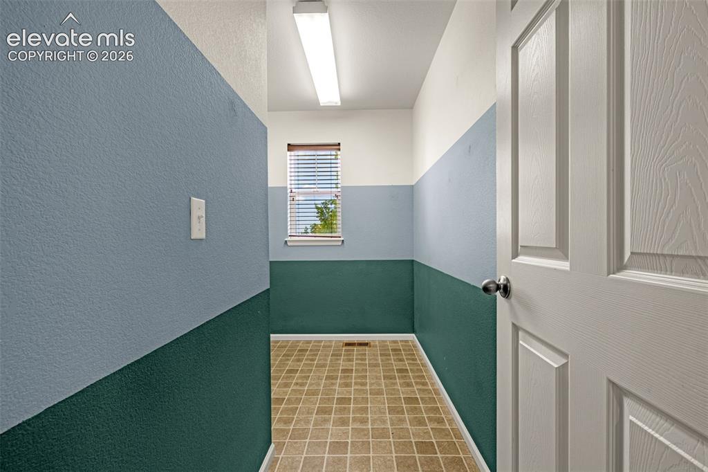 Image 31 of 44: Dedicated laundry room upstairs