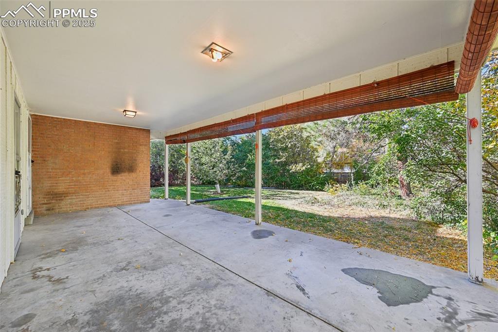 Image 8 of 50: Large covered back patio