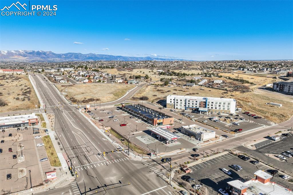 Image 20 of 25: Birds eye view of property with a mountain view