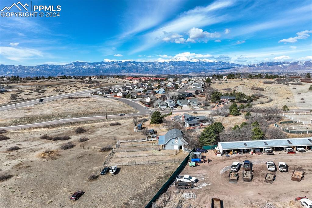 Image 4 of 25: Birds eye view of property featuring a mountain view