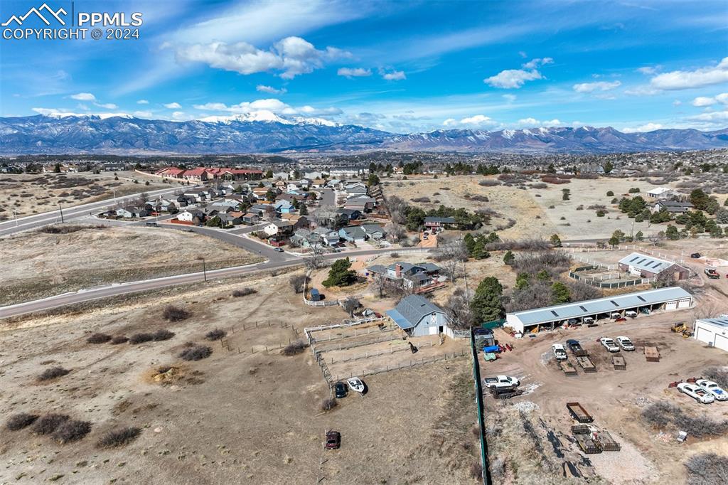 Image 9 of 25: Birds eye view of property featuring a mountain view