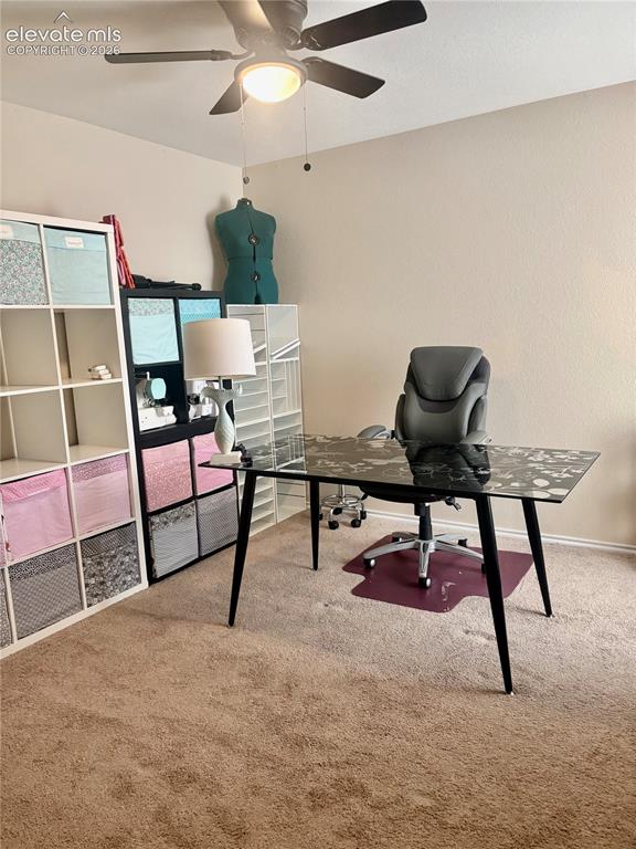 Image 17 of 32: Carpeted room featuring a ceiling fan with integrated lighting, neutral wal