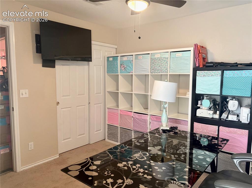 Image 18 of 32: Recessed lighting and ceiling fan overhead